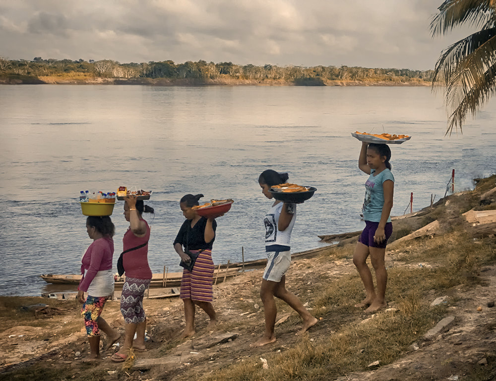 women bring lunch, amazon river, peru
