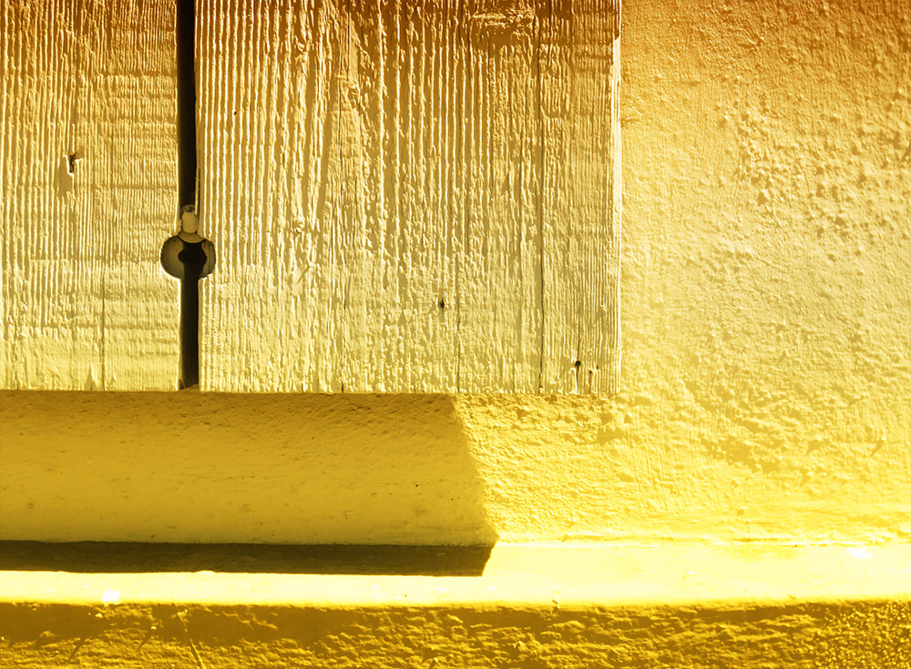 yellow paint, shadow, step, woodgrain, planks.